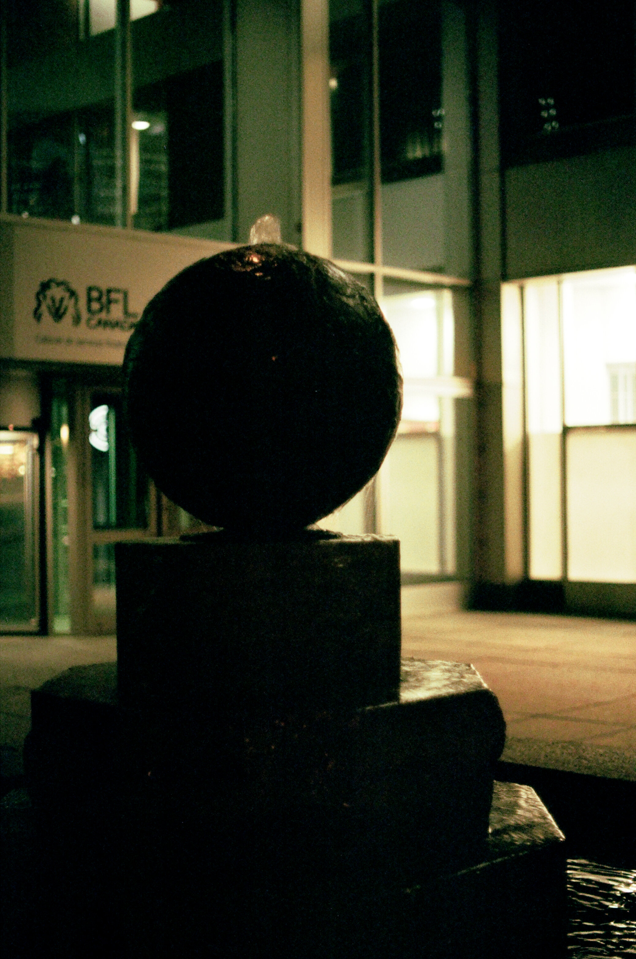 Ball-shaped water fountain at night