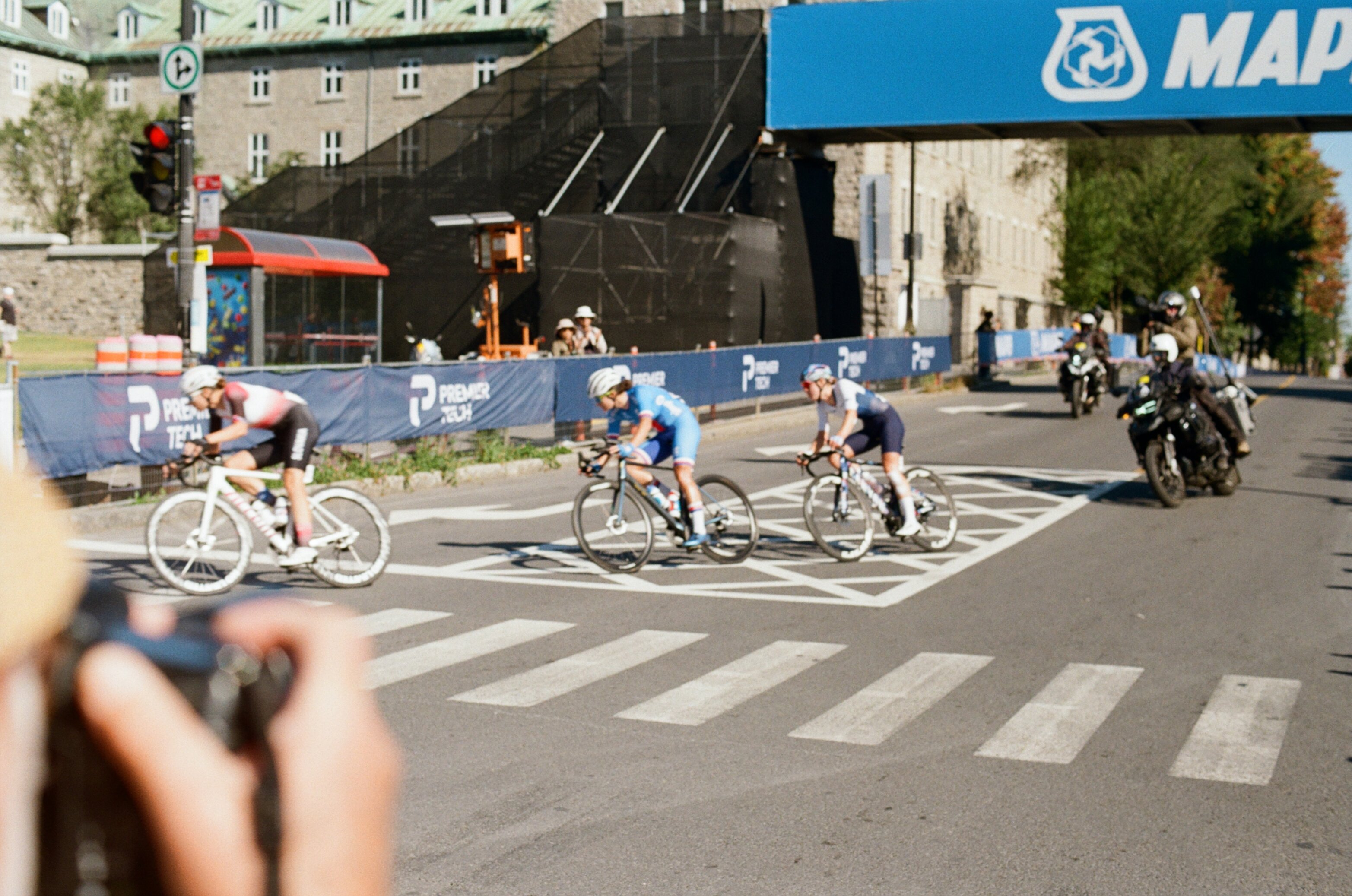 Cyclists round a corner in a women's bike race