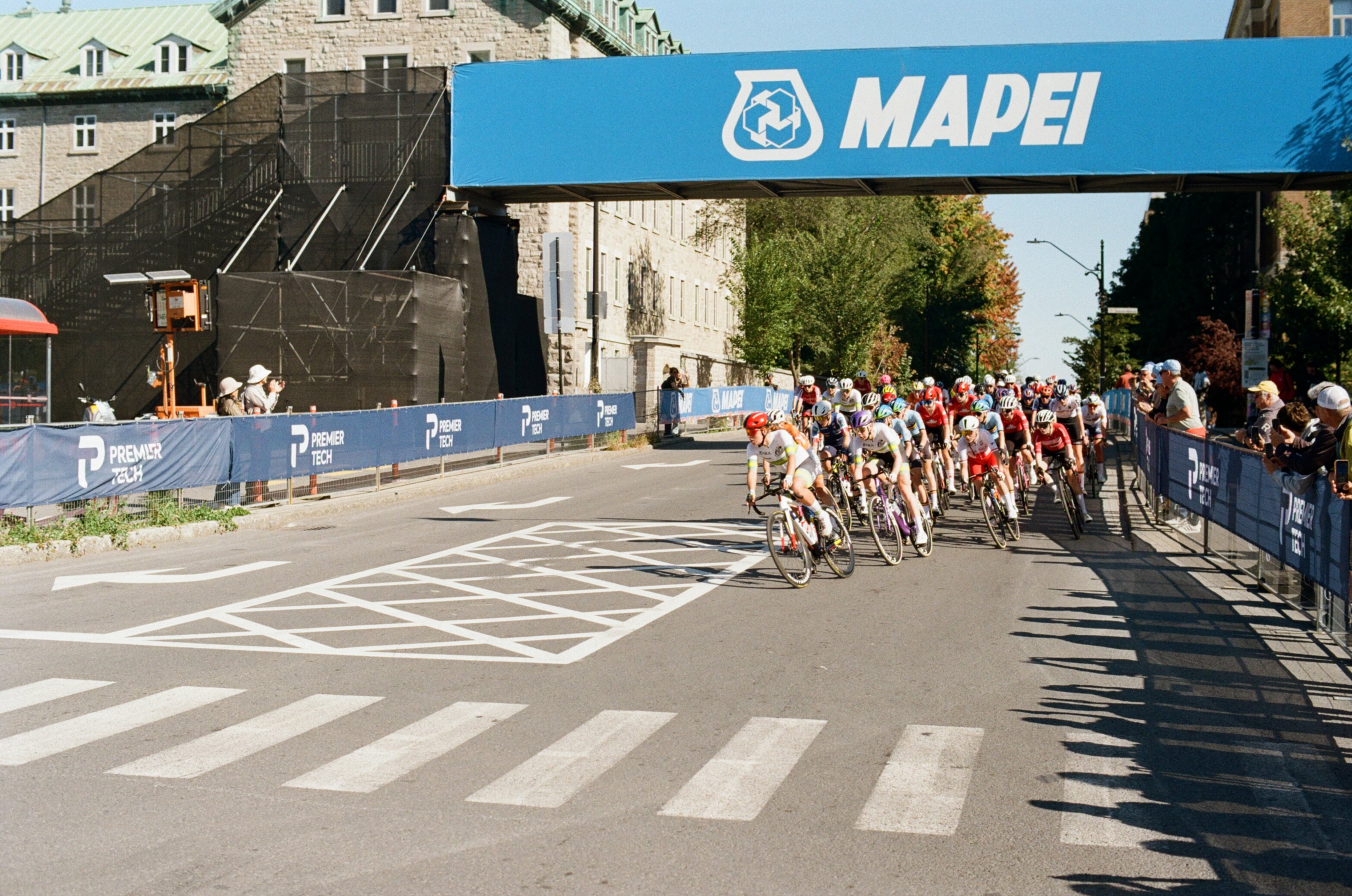 Cyclists round a corner in a women's bike race