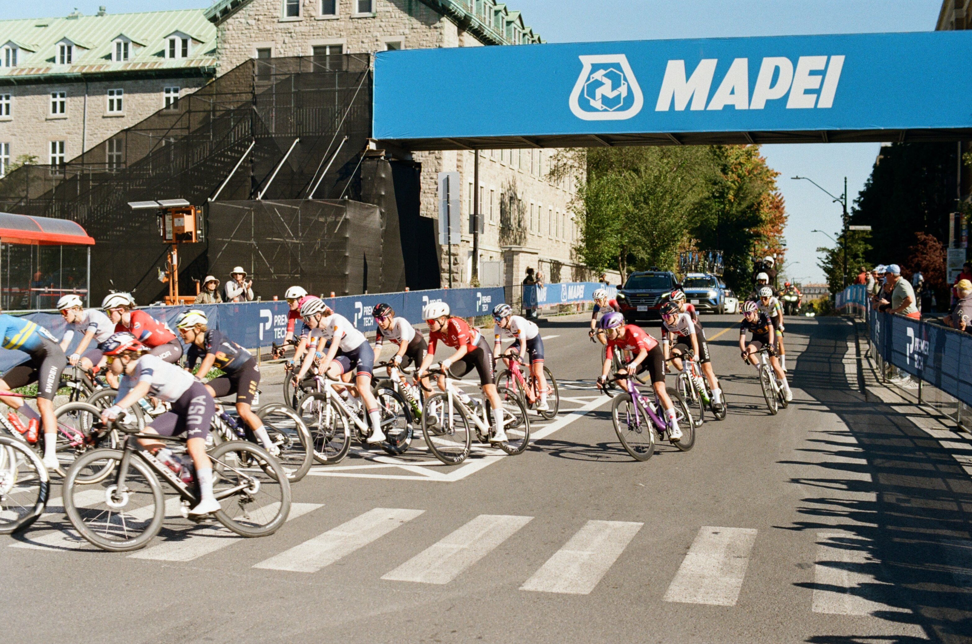 Cyclists round a corner in a women's bike race