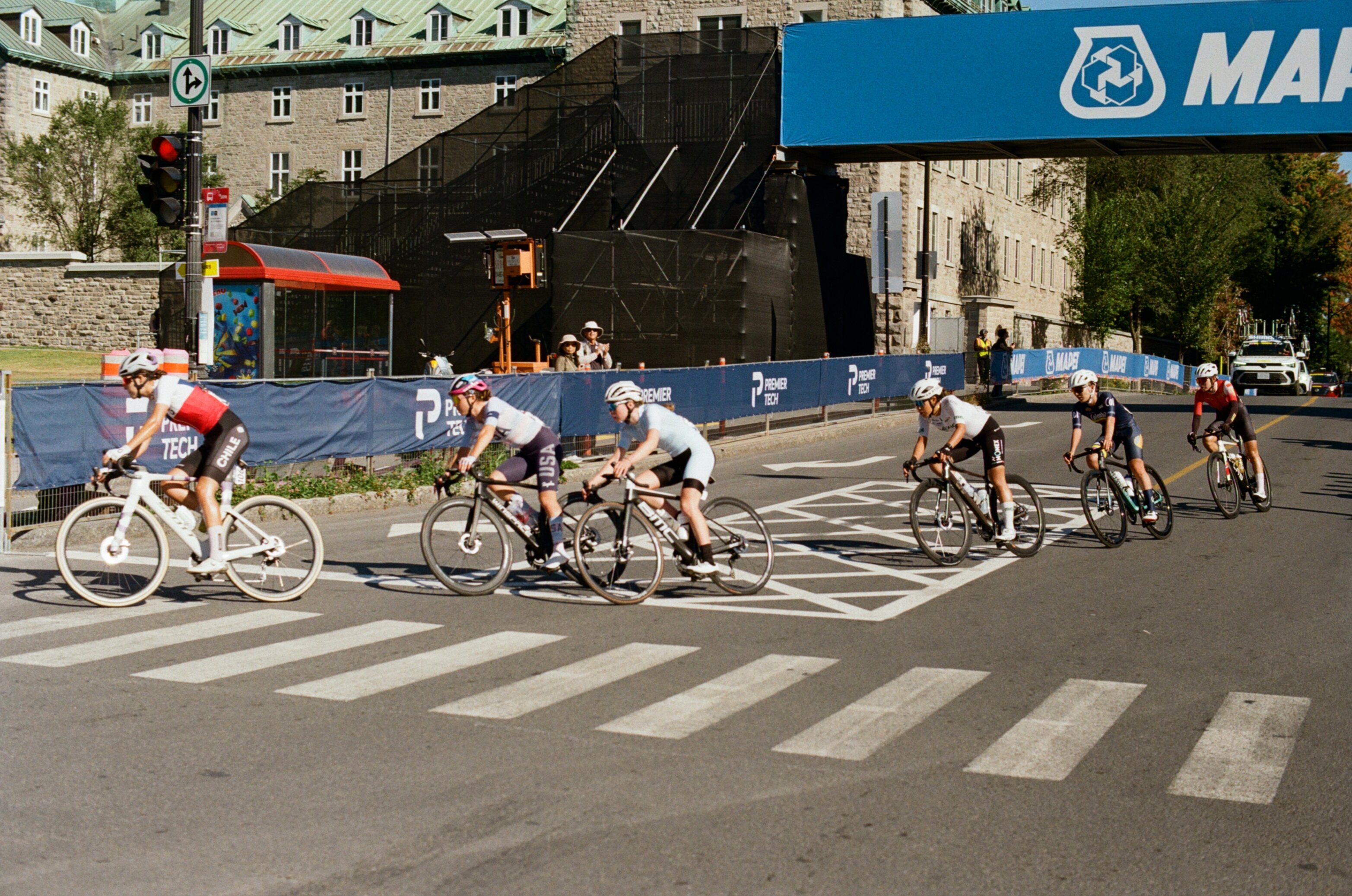 Cyclists round a corner in a women's bike race