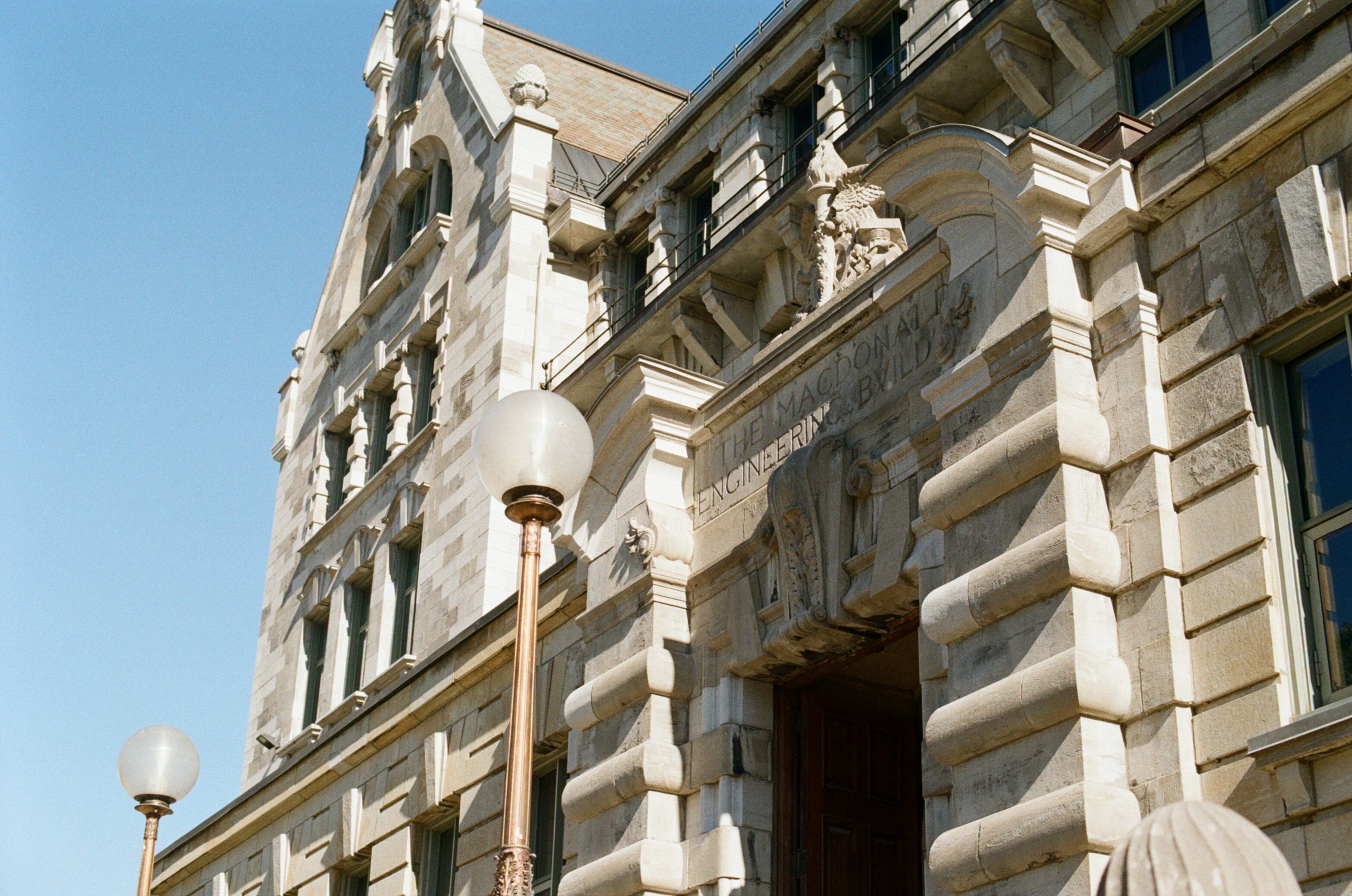 Stone building with a sign that says 'THE MACDONALD ENGINEERING BUILDING'