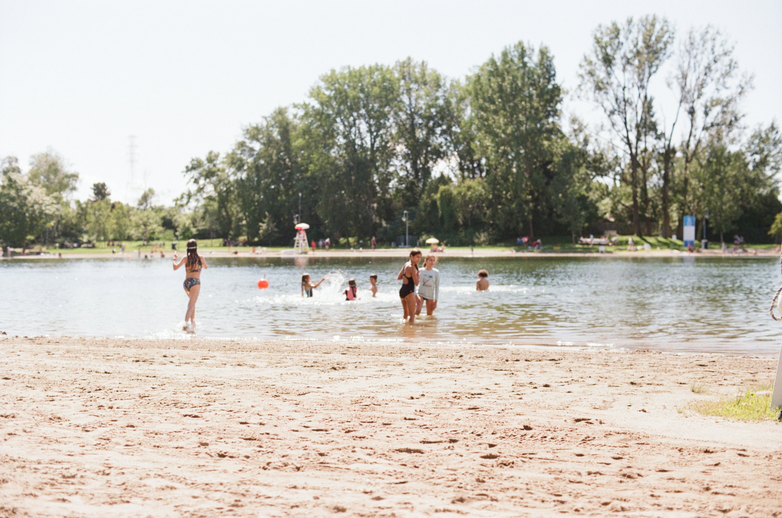 Kids play in the water at the beach